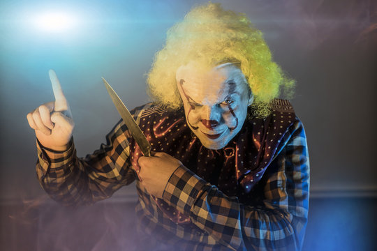 scary clown on Halloween background