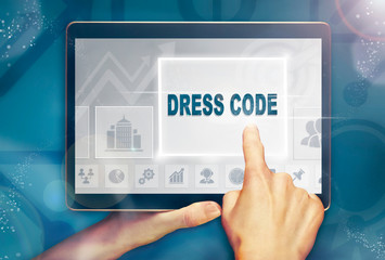 A hand selecting a Dress Code business concept on a clear screen with a colorful blurred background.