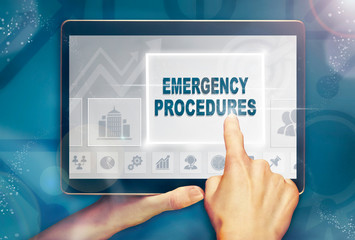 A hand selecting a Emergency Procedures business concept on a clear screen with a colorful blurred...