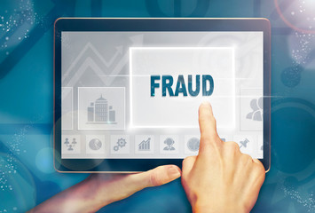 A hand selecting a Fraud business concept on a clear screen with a colorful blurred background.