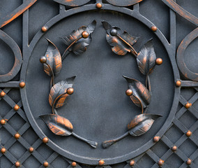 Wrought-iron gates, ornamental forging, forged elements close-up.