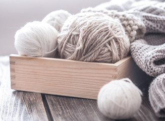 home hobbies, cozy knitted sweaters a wooden background