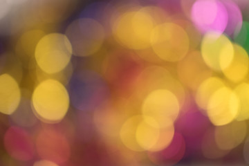 Abstract bokeh light. Christmas mood. Orange, pink, golden and blue lights.