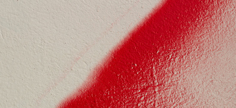 Colorful Wall Background. White Painted Wall With Red Graffiti Fragment