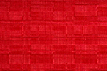 Red fabric background.

