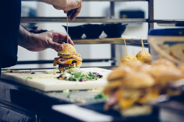 Close up of male hands prepare spanish tapas