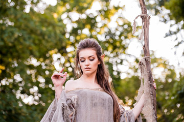 beautiful elf ears girl. fantasy young woman in woods
