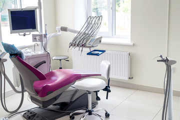 Dentistry inside, violet chair for patient and equipment