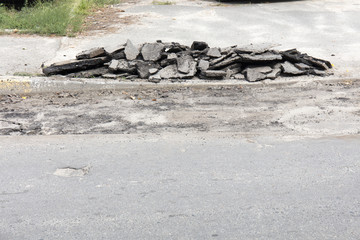 bad asphalt road, repair of asphalt road, pit on the road
