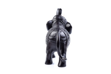 Black Engraved pattern gold elephant made of resin like wooden carving with white ivory. Stand on white background, Isolated, Art Model Thai Crafts, For decoration Like in the spa.
