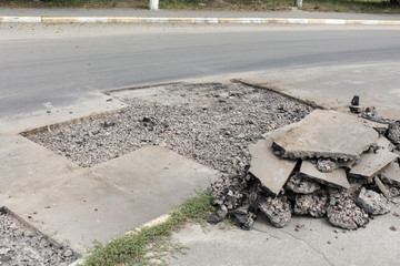 bad asphalt road, repair of asphalt road, pit on the road
