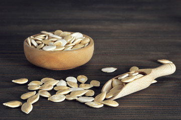 Pumpkin seeds on wooden table