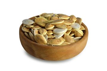 Pumpkin seeds in a bowl isolated on white background