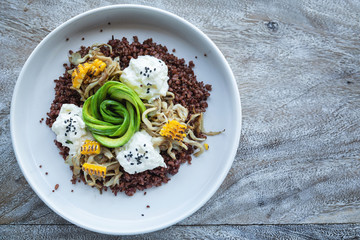 Delicious dish with Avocado, cheese, corn and sprouted wheat grains. © blackday