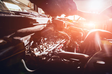 Repairing engine at service station. Car repair. Background