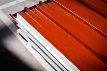 Fototapeta premium Siding pallet row set rack ready for construction on hardware industrial store inventory background. Manufacture production pattern stack, retail customer working shop abstraction storage backdrop.