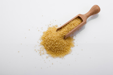 fresh couscous on a white acrylic background