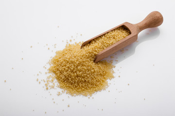 fresh couscous on a white acrylic background