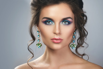 Gorgeous woman wearing beautiful expensive earrings with jewels