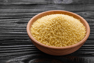 fresh couscous on a wooden rustic background