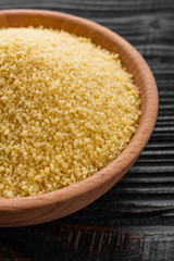 fresh couscous on a wooden rustic background