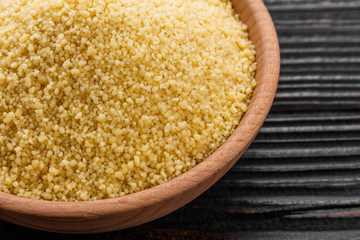 fresh couscous on a wooden rustic background