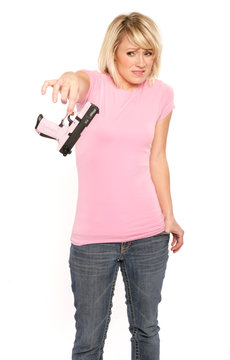 Blonde Woman Afraid of Handgun