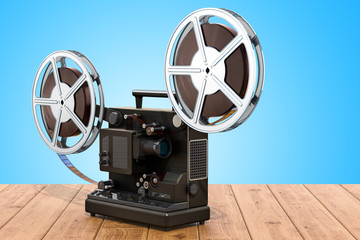 Obraz premium Retro cinema projector on the wooden table. 3D rendering