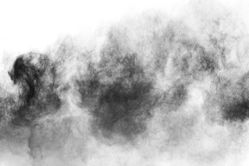 particles of charcoal on white background,abstract powder splatted on white background,Freeze motion of black powder exploding or throwing black powder.