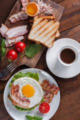 Fried egg and coffee on table