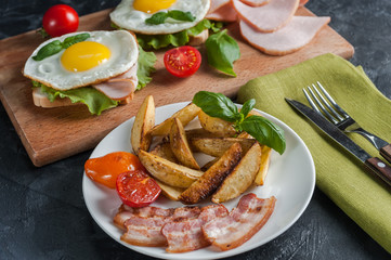 Fried potatoes and bacon on plate