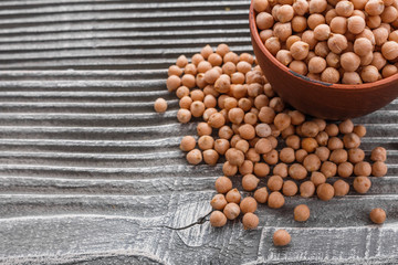 uncooked chickpeas on a wooden rustic background