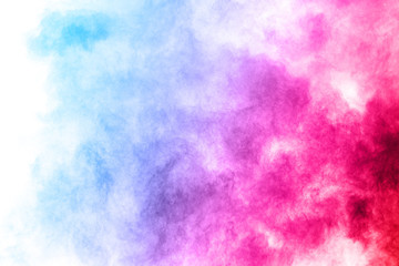 Colorful powder explosion on white background. Colored cloud. Colorful dust explode. Paint Holi.