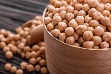 uncooked chickpeas on a wooden rustic background