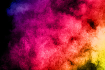 abstract colored dust explosion on a black background.abstract powder splatted background,Freeze...