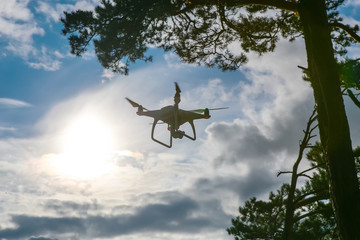 flying drone in blue sky