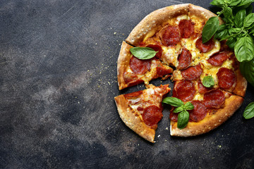 Traditional italian pizza pepperoni with salami and cheese.Top view with copy space. - obrazy, fototapety, plakaty
