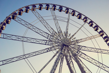 ferris wheel on background of blue sky