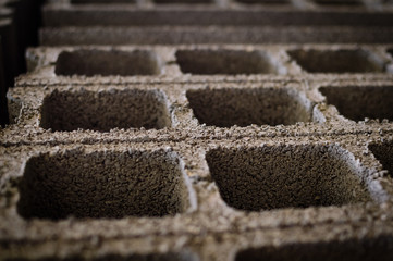 Pallet of concrete blocks industrial design building materials textured background. Build work storage unit.