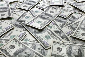 heap of one hundred dollars notes as background