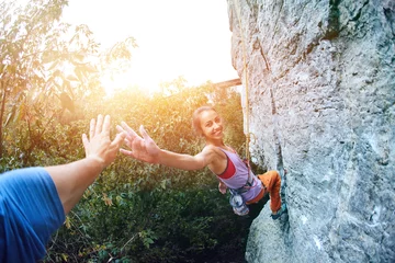 Foto auf Acrylglas young slim female rock climber climbing on the cliff © vitaliymateha