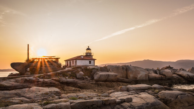 Lighthouse on the island of Arousa at sunset in Galicia, Spain
