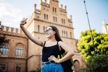 Young asian woman student happy smile take selfie on campus university