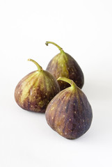 Three fig fruits on a white background.