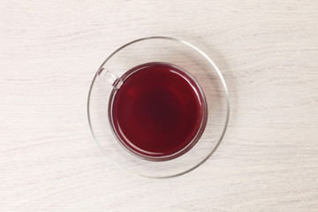 Hibiscus flower tea in glass tea cup      