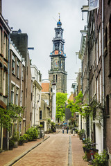 Street and Westerkerk Church tower in Amsterdam, Netherlands, Europe