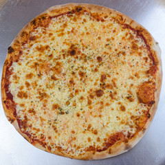 Pizza time on light wooden table background