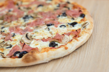 Pizza time on light wooden table background