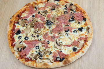 Pizza time on light wooden table background