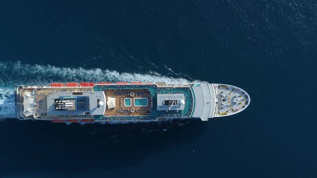 Tourist ship in the blue sea, aerial view